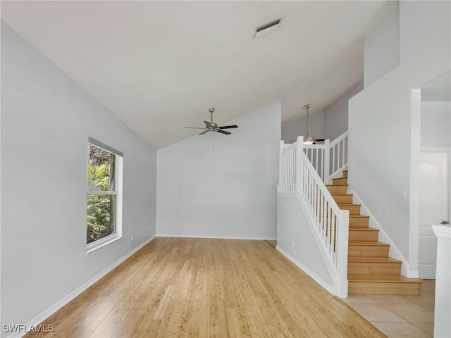 interior space featuring light wood-type flooring, ceiling fan, and lofted ceiling