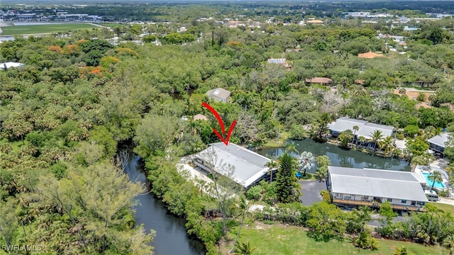 2511 Estey Ave Unit E4, Naples, FL 34104 - aerial view of property and surrounding area with a large body of water and a forest