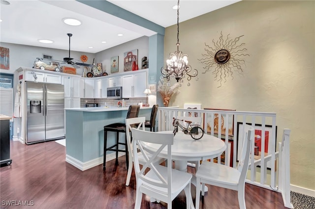 2511 Estey Ave Unit E4, Naples, FL 34104 - dining space with dark wood-style flooring, a chandelier, and recessed lighting
