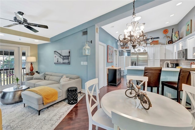 2511 Estey Ave Unit E4, Naples, FL 34104 - dining room featuring dark wood-style flooring, a ceiling fan, a chandelier, and recessed lighting