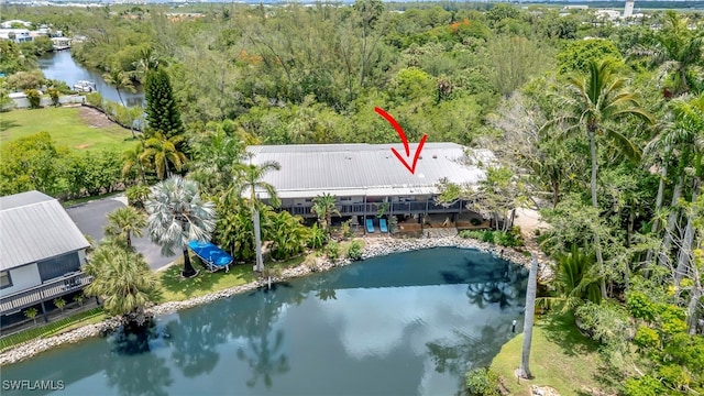 2511 Estey Ave Unit E4, Naples, FL 34104 - view of subject property with a nearby body of water and a heavily wooded area
