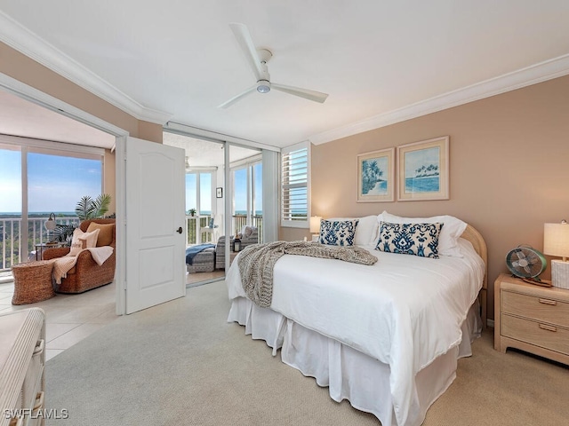 bedroom featuring ceiling fan, ornamental molding, and access to outside