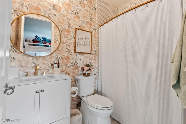 bathroom featuring vanity and toilet