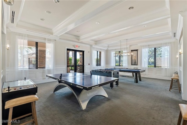 rec room featuring dark colored carpet, beamed ceiling, a wealth of natural light, and french doors