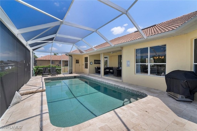 view of swimming pool with an outdoor hangout area, ceiling fan, a lanai, a grill, and a patio