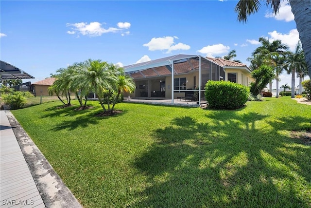 view of yard featuring a lanai and a patio area