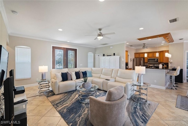 tiled living room featuring ceiling fan and ornamental molding