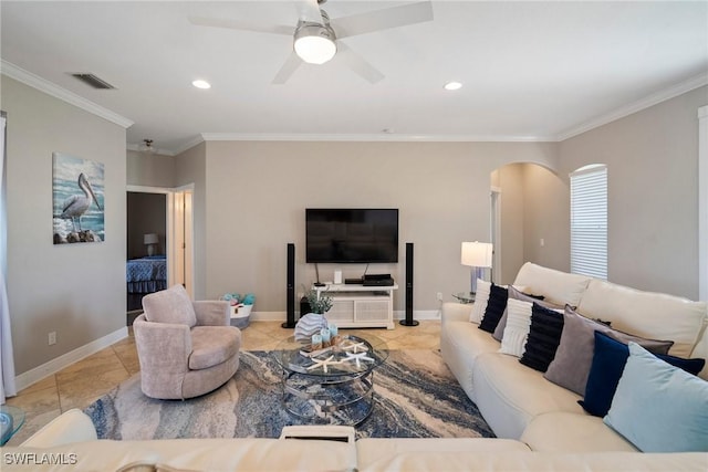 living room with ceiling fan, ornamental molding, and light tile patterned flooring