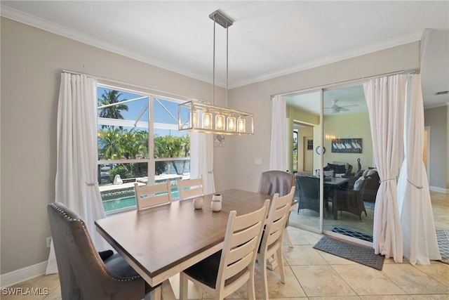 tiled dining room with ceiling fan and crown molding