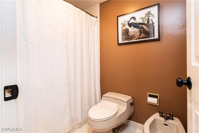 bathroom featuring a bidet and toilet