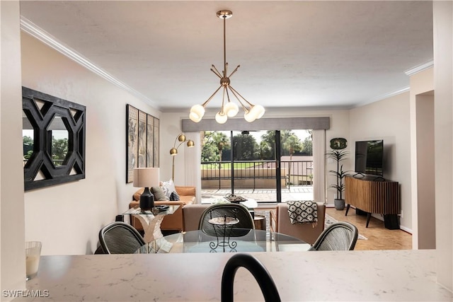 dining area featuring light hardwood / wood-style floors, a chandelier, and crown molding