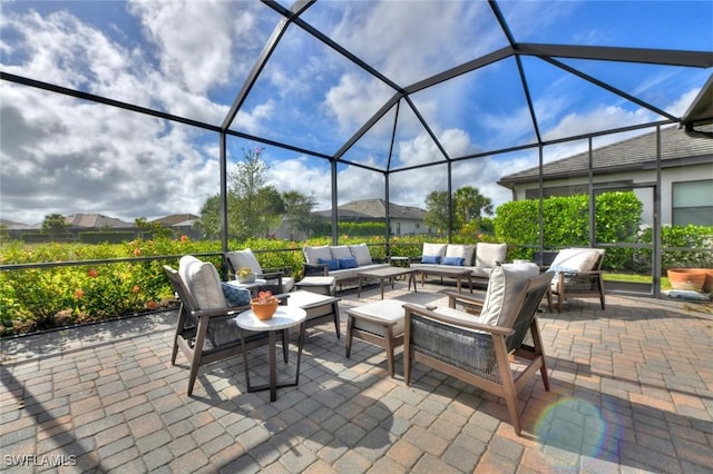 view of patio featuring an outdoor living space and a lanai