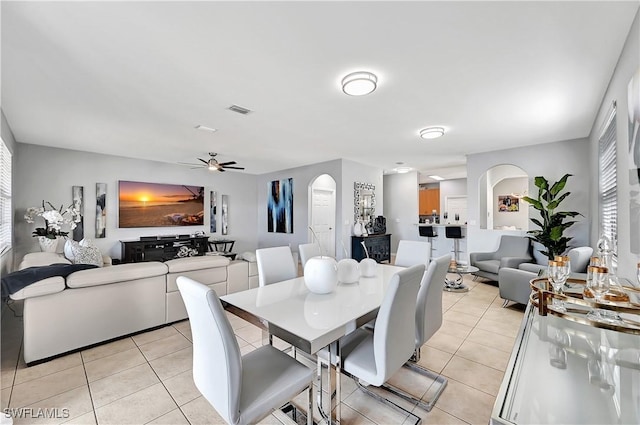 dining area featuring ceiling fan and light tile patterned floors