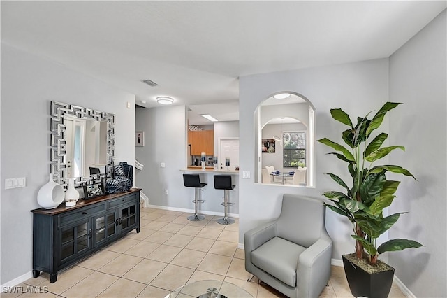 living area with light tile patterned floors