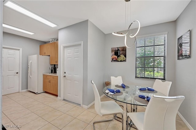 dining area featuring light tile patterned floors