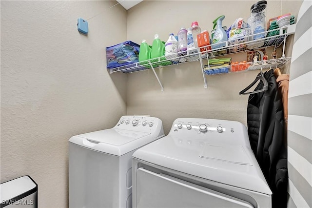 laundry area featuring washing machine and clothes dryer