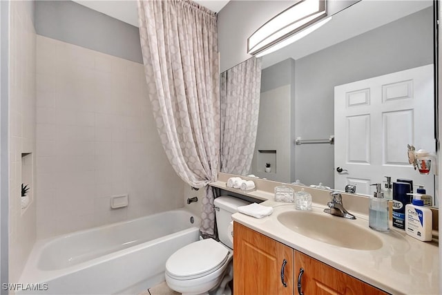 full bathroom featuring shower / bath combo with shower curtain, vanity, and toilet