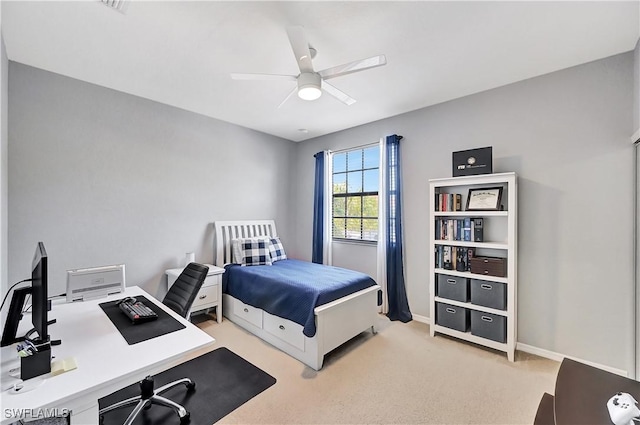 bedroom featuring light carpet and ceiling fan