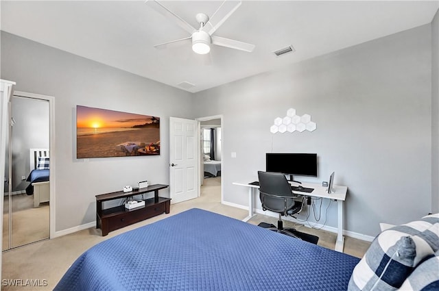 bedroom featuring ceiling fan and light colored carpet