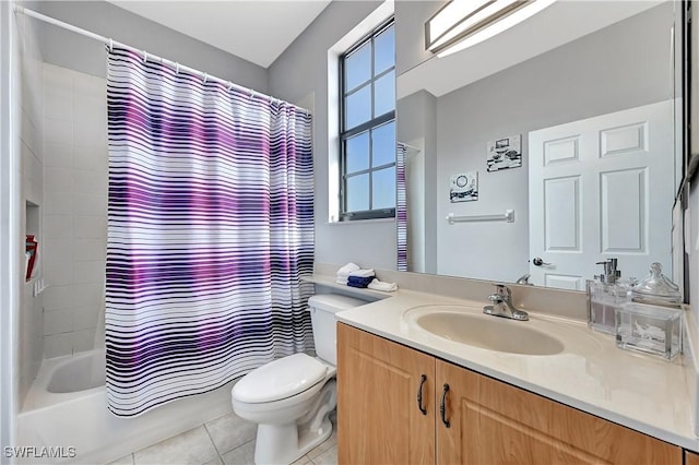 full bathroom with tile patterned floors, vanity, shower / tub combo, and toilet