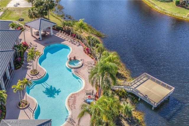 view of pool with a gazebo, a patio area, and a water view