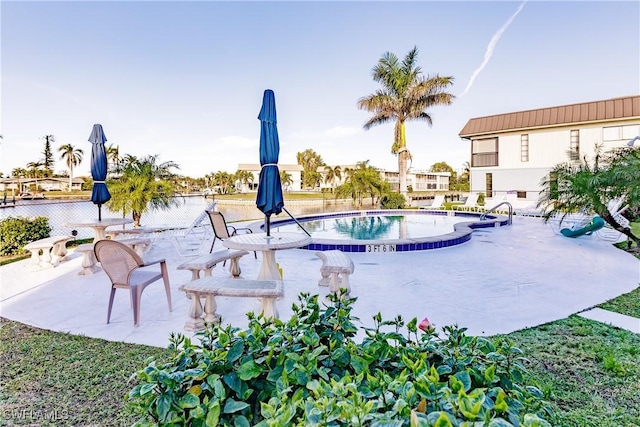 view of pool featuring a patio