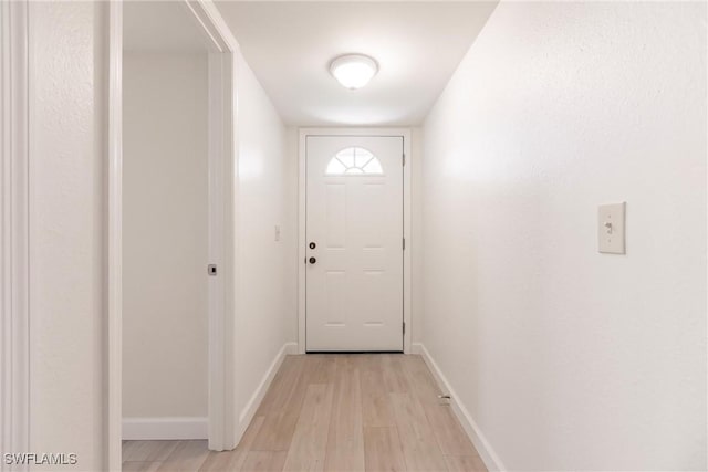 doorway with light hardwood / wood-style floors