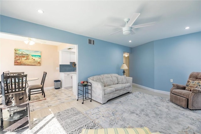 living room featuring ceiling fan