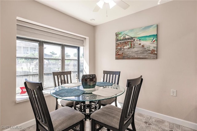 dining space featuring ceiling fan