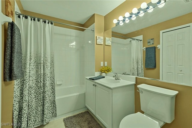 full bathroom featuring tile patterned floors, shower / bath combo with shower curtain, vanity, and toilet