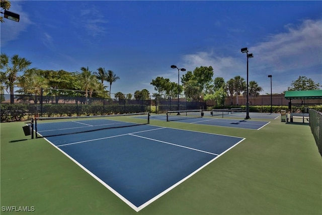 view of sport court with basketball hoop