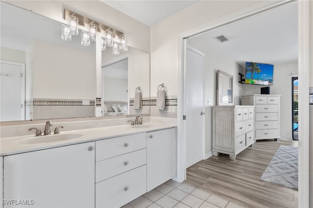 bathroom featuring hardwood / wood-style flooring and vanity