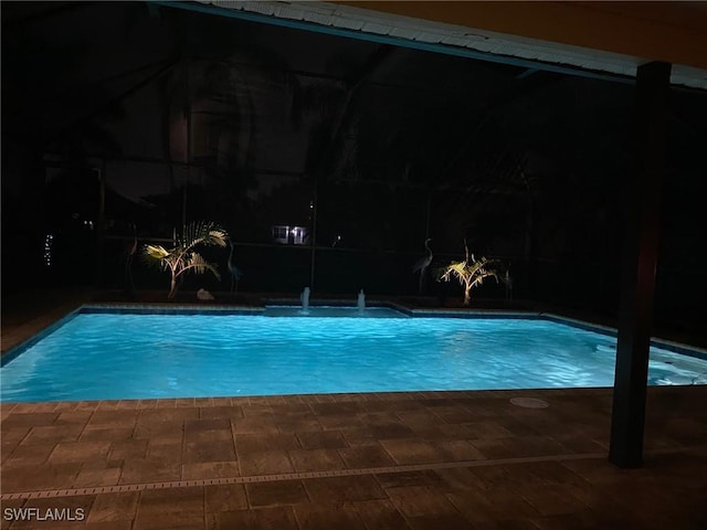 view of swimming pool featuring pool water feature