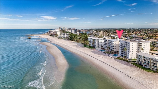 birds eye view of property featuring a water view and a view of the beach