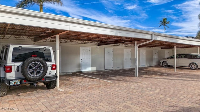 view of vehicle parking with a carport