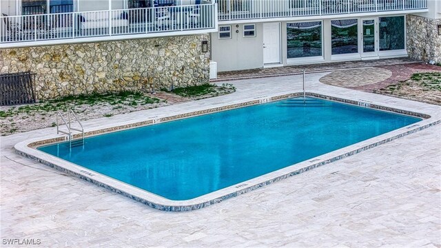 view of pool with a patio