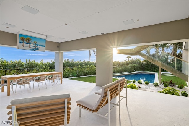 view of patio with a fenced in pool