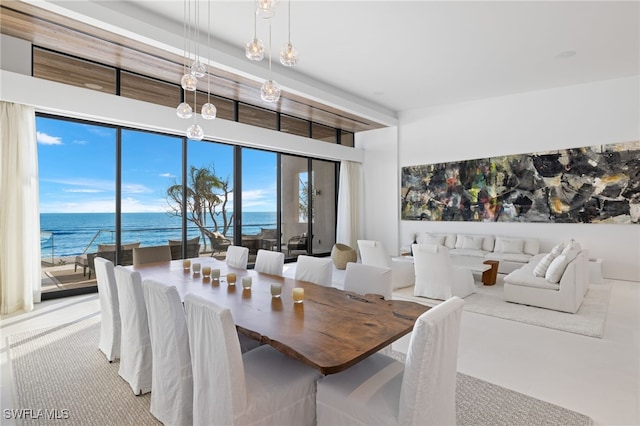 dining room featuring a water view