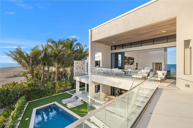 view of swimming pool with a water view