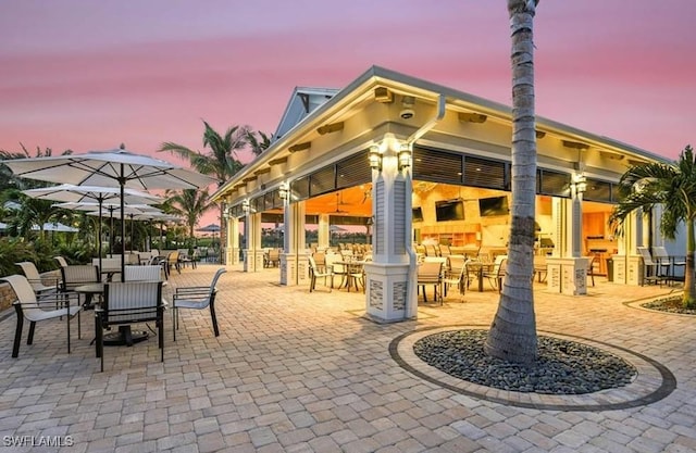 view of patio terrace at dusk