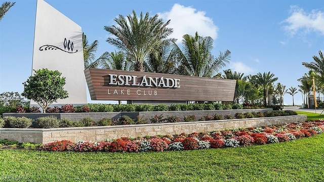 community / neighborhood sign with a lawn