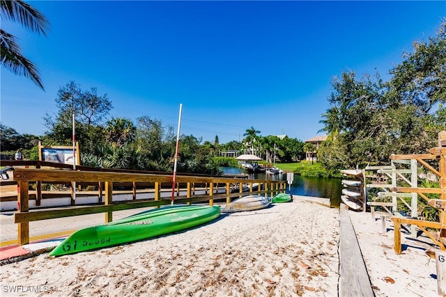 view of community with a water view