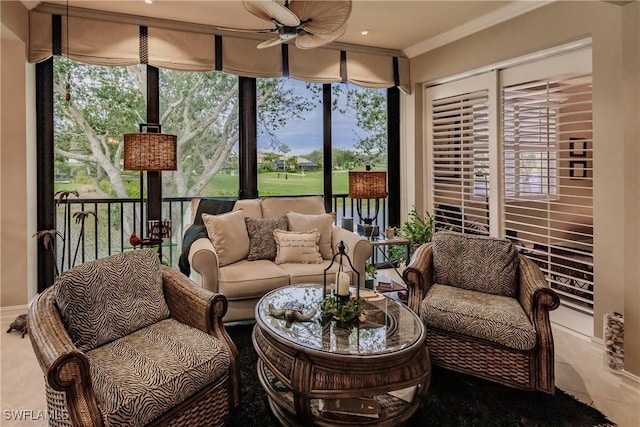 sunroom / solarium featuring ceiling fan