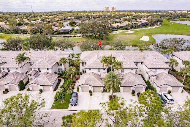 birds eye view of property with a residential view, golf course view, and a water view