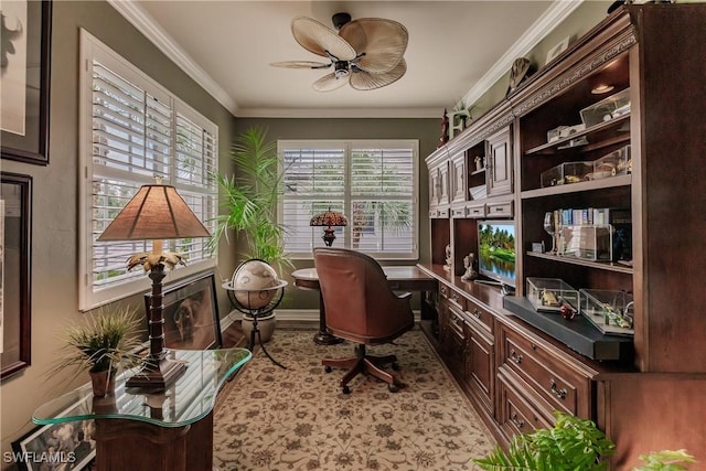 home office featuring baseboards, built in study area, crown molding, and ceiling fan