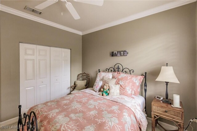 bedroom featuring a closet, ceiling fan, and ornamental molding