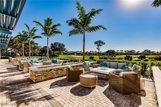 view of patio / terrace featuring an outdoor living space with a fire pit