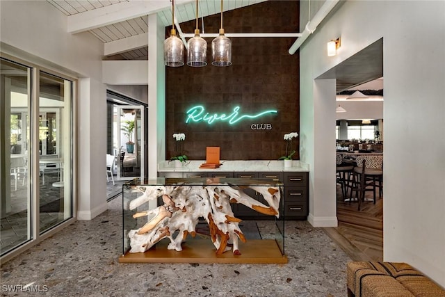 dining space featuring lofted ceiling with beams, wood ceiling, and baseboards