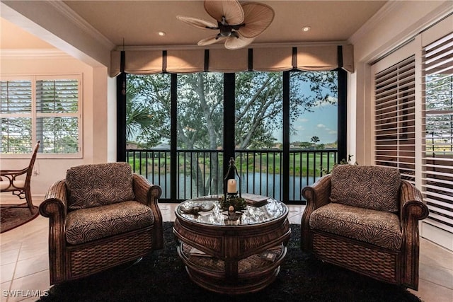 sunroom / solarium featuring plenty of natural light and a ceiling fan