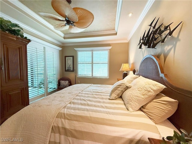 bedroom with access to exterior, a raised ceiling, a ceiling fan, and ornamental molding
